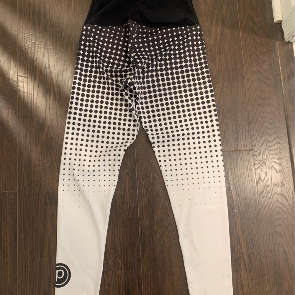 Onzie by Pure Barre brand white and black dotted workout leggings